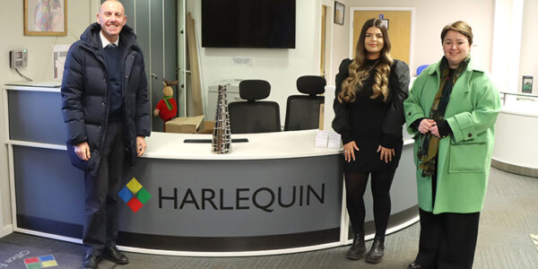 Cllr Rob Waltham, Scunthorpe MP Holly Mumby-Croft at Harlequin with one of their employees.