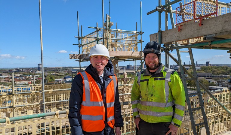 Cllr Rob Waltham pictured with Scott Green, site manager at UK Restoration Services. They are at the top of the former St. John's Church in Scunthorpe, which is undergoing a restoration programme