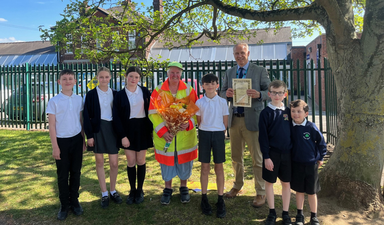 Sue Parsons, school crossing patrol with some pupils and Cllr Tim Mitchell