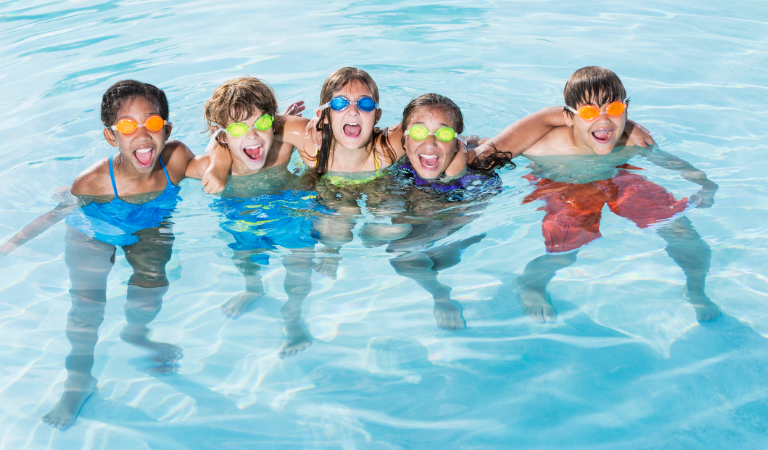 Photo of children having fun in a swimming pool