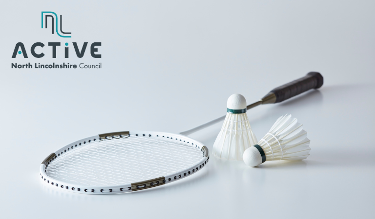 Photo of a badminton racket and shuttlecock