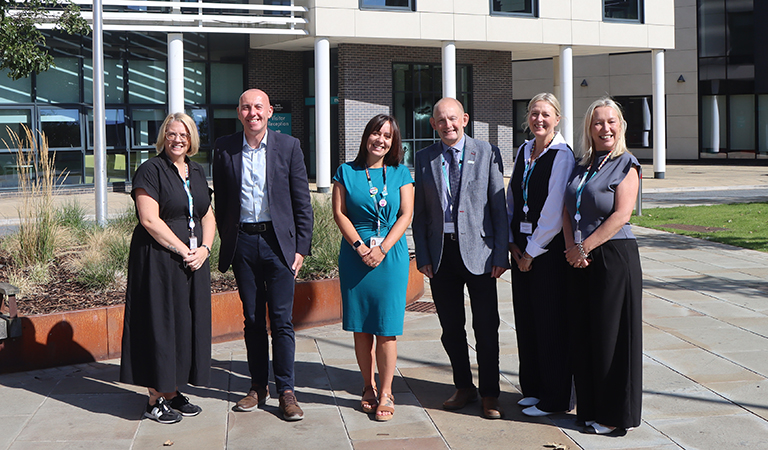 Pictured (l to r): Debbie Dobson, Cllr Rob Waltham, Helen Rose, Cllr Richard Hannigan, Victoria Lawrence, director adults and health and Alison Barker, chief executive stood outside Church Square House.