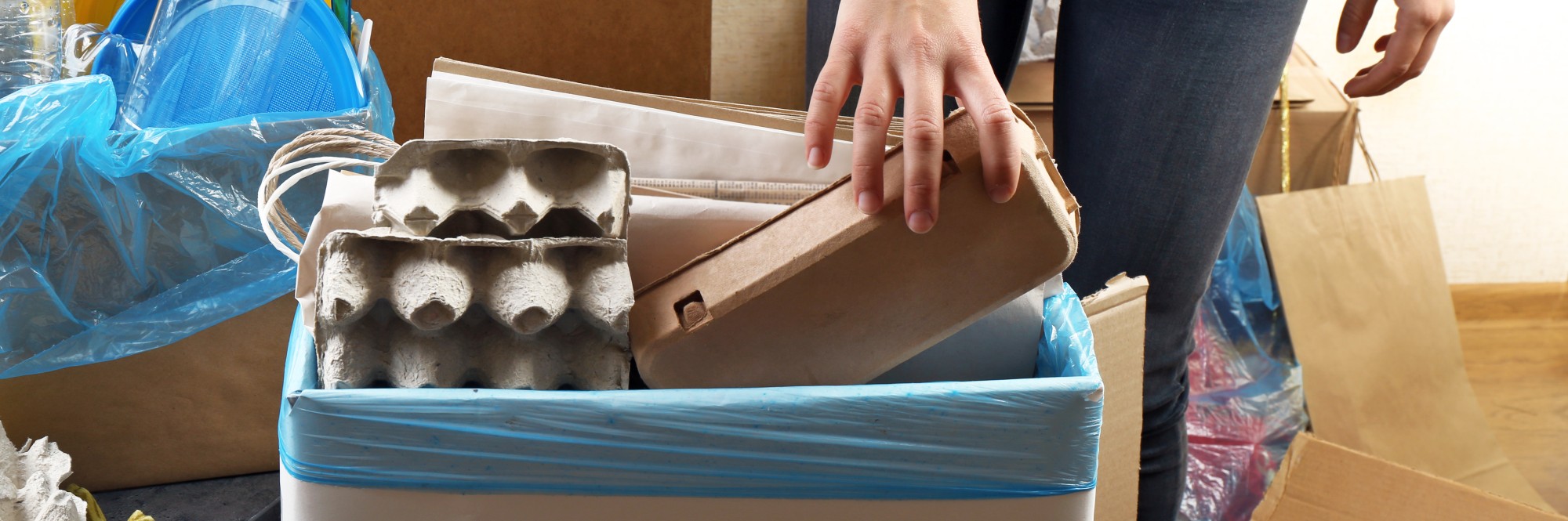 women recycling cardboard