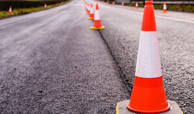 An image of a road with traffic cones laid out.