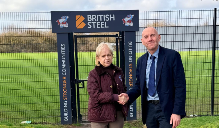 A picture of Cllr Rob Waltham and Michelle Harness at Scunthorpe United training ground
