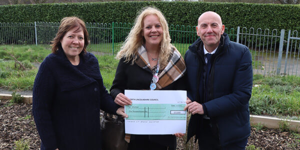 Cllr Waltham and Cllr Reed presenting a grant cheque to Volunteen