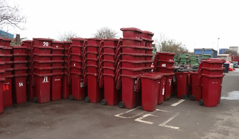 Old burgundy bins stacked up