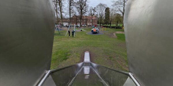 View of Baysgarth Park with children playing equipment taken from the top of a slide