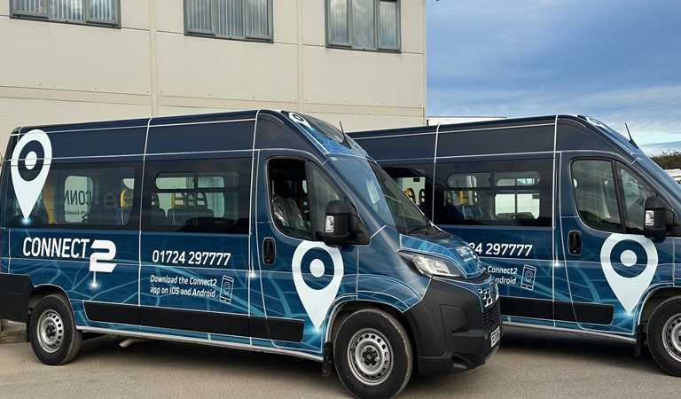 Photo of two Connect2 buses parked next to eachother