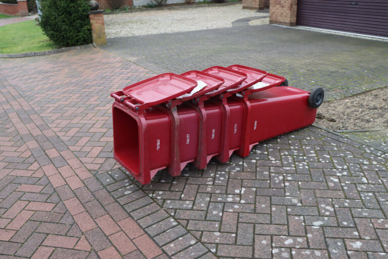 Stack of old burgundy bins