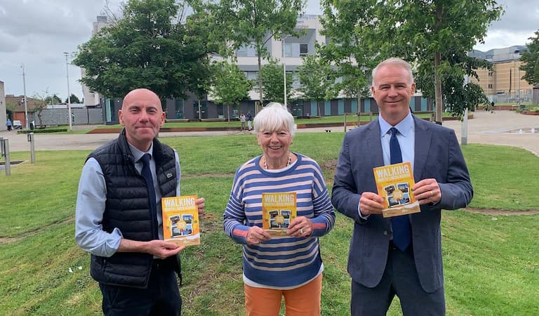 Cllr Rob Waltham, Cllr Christine Patterson and Cllr Tim Mitchell holding the new summer walking programme.