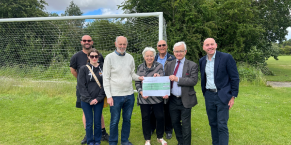 A photo of Cllr Rob Waltham, Cllr Christine Patterson, Cllr Keith Vickers, and MP Martin Vickers presenting the community grant cheque to Barton Junior Football Club representatives
