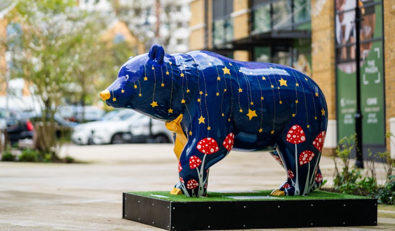 A large bear decorated in bright colours as part of the bear hunt project