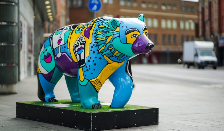 A large bear decorated in bright colours as part of the bear hunt project